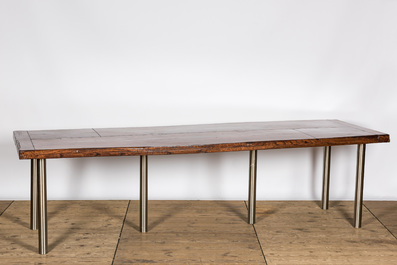 A lacquered wooden table on metal legs, 20th C.