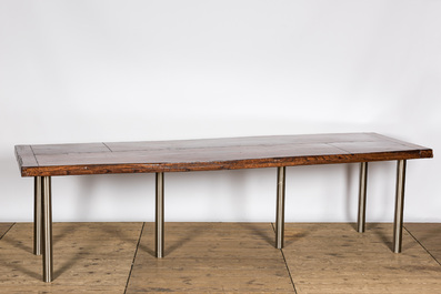A lacquered wooden table on metal legs, 20th C.