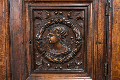 A walnut 'credence' case with portrait medallions, probably France, late 17th C. with later elements