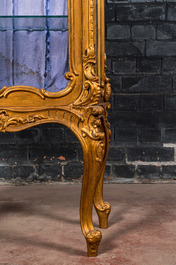 A richly carved gilt wooden Rococo-style display cabinet, 19th C.