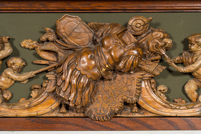 An exceptionally long carved wooden frieze with allegorical depictions of putti, 18th C.