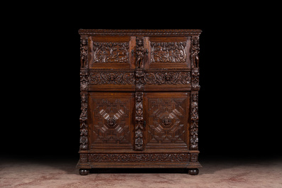 A Flemish richly carved oak 'beeldenkast' or cupboard, 17th C.