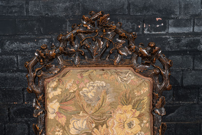 A Black Forest wooden armchair with acorns and oak leafs, 19th C.