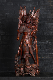 A large Chinese carved wooden group with a warrior and a child, 20th C.