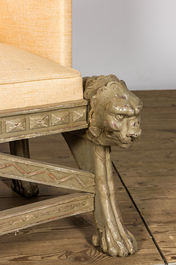 A gray patinated wooden armchair with lion heads, 20th C.