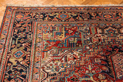 A large rectangular ornamental Heriz rug, 19/20th C.
