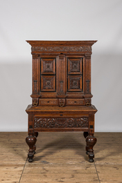 An oak and partly ebonised wooden cabinet on foot, 19th C. with older elements