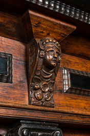 A Dutch partly ebonised wooden four-door cupboard, 19th C.