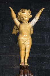 A richly carved walnut jardini&egrave;re or stand with angels, 19th C.