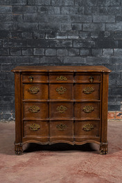 A French Louis XV-style oak commode on lion paw stands, 19th C.