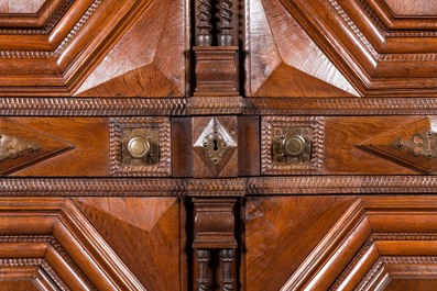 An imposing baroque-style parquetry oak four-door cupboard, 19th C.