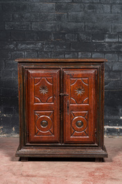 A polychromed walnut and pine wood two-door cupboard, probably Germany, 19th C.