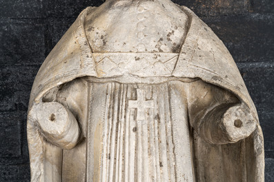 A large limestone sculpture of a standing bishop, 18th C.