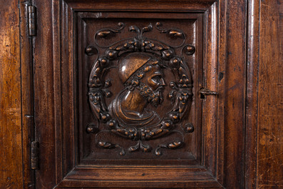 A walnut 'credence' case with portrait medallions, probably France, late 17th C. with later elements
