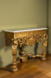 An Italian richly carved gilt wooden console with marble top, 19th C