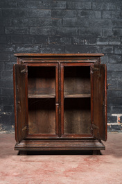 A polychromed walnut and pine wood two-door cupboard, probably Germany, 19th C.