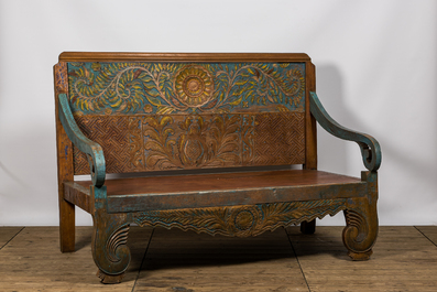 A large Indian polychrome wooden couch with floral design, 20th C.