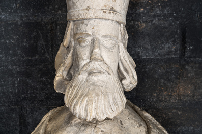 A large limestone sculpture of a standing bishop, 18th C.