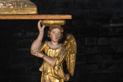 A polychromed and gilt wooden stand supported by two angels, 18th C.