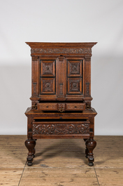 An oak and partly ebonised wooden cabinet on foot, 19th C. with older elements