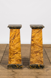A pair of faux-marbre wooden pedestals, ca. 1900