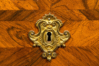 A French mahogany veneered gilt bronze mounted chest of drawers with marble top, 18th C.