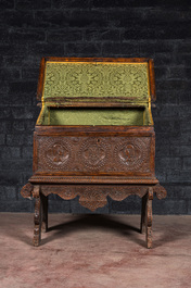 A walnut cassone or marriage chest on stand, probably Italy, 19th C. with older elements
