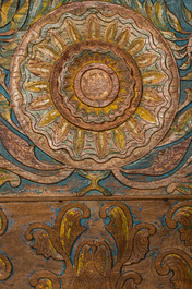 A large Indian polychrome wooden couch with floral design, 20th C.