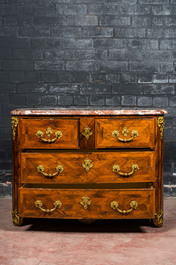 A French mahogany veneered gilt bronze mounted chest of drawers with marble top, 18th C.