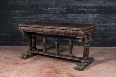 A French walnut table in Henri II-style