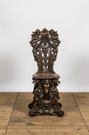 A richly carved Italian walnut sgabello, 19th C.