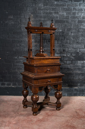 An oak linen press on foot with ebonised accents, 19th C.