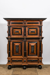 A Dutch partly ebonised wooden four-door cupboard, 19th C.