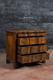 A French Louis XV-style oak commode on lion paw stands, 19th C.