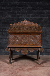 A walnut cassone or marriage chest on stand, probably Italy, 19th C. with older elements