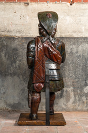 A polychrome wooden figure of a Scottish nobleman, 19th C.