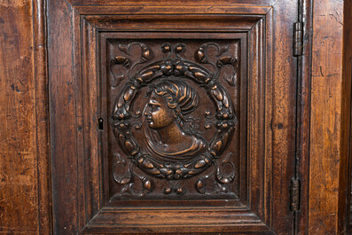 A walnut 'credence' case with portrait medallions, probably France, late 17th C. with later elements