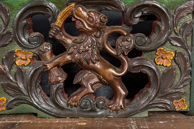 Two Dutch polychrome wooden sheafs of farm wagons with a lion, 19th C.
