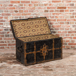 A wrought iron mounted wooden coffer with leather upholstery, 18th C.