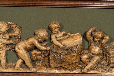 An exceptionally long carved wooden frieze with allegorical depictions of putti, 18th C.