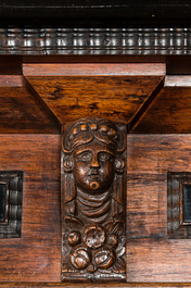 A Dutch partly ebonised wooden four-door cupboard, 19th C.