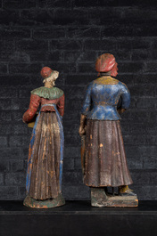 A pair of large polychrome terracotta figures of a fish- and fruit seller, 19th C.