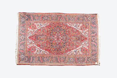 A large rectangular ornamental Heriz rug, 1st half 20th C.