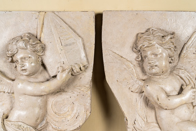 Two French patinated wooden reliefs with putti wearing cardinal attributes, 17/18th C.