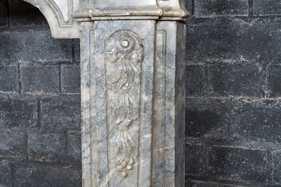 A French Louis XV-style gray marble fireplace with mascaron, 19th C.