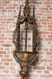 A pair of large polychromed and gilt processional torches with cherub heads, 18th C.