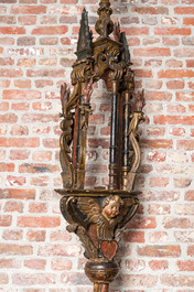A pair of large polychromed and gilt processional torches with cherub heads, 18th C.