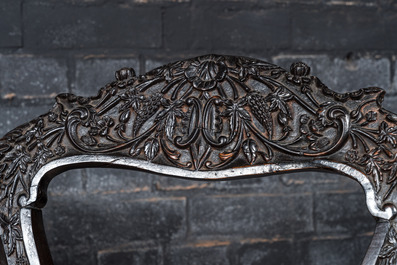 An Anglo-Indian colonial carved wooden sofa with two matching chairs, late 19th C.