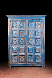 A French blue patinated oak two-door cupboard, 20th C. with older elements