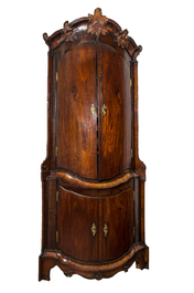 A large baroque-style four-door corner cupboard, probably Italy, 18/19th C.